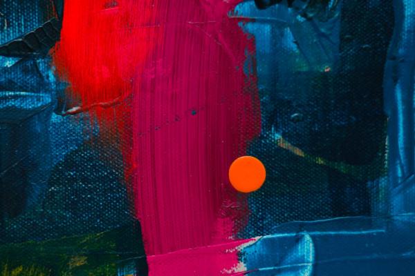 abstract painting detail. A blue field is overlaid with a scarlet brushstroke.