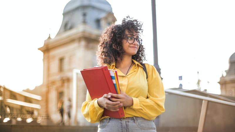 student with binder