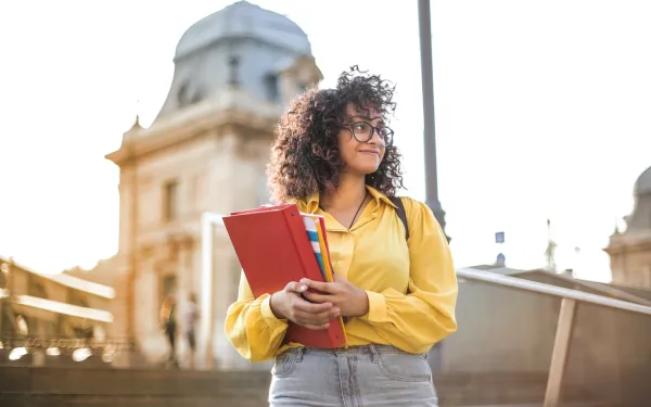 student with binder