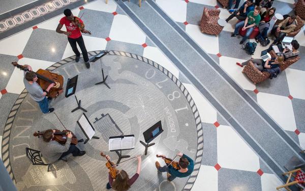 picture of a musical performance in front of a small audience.