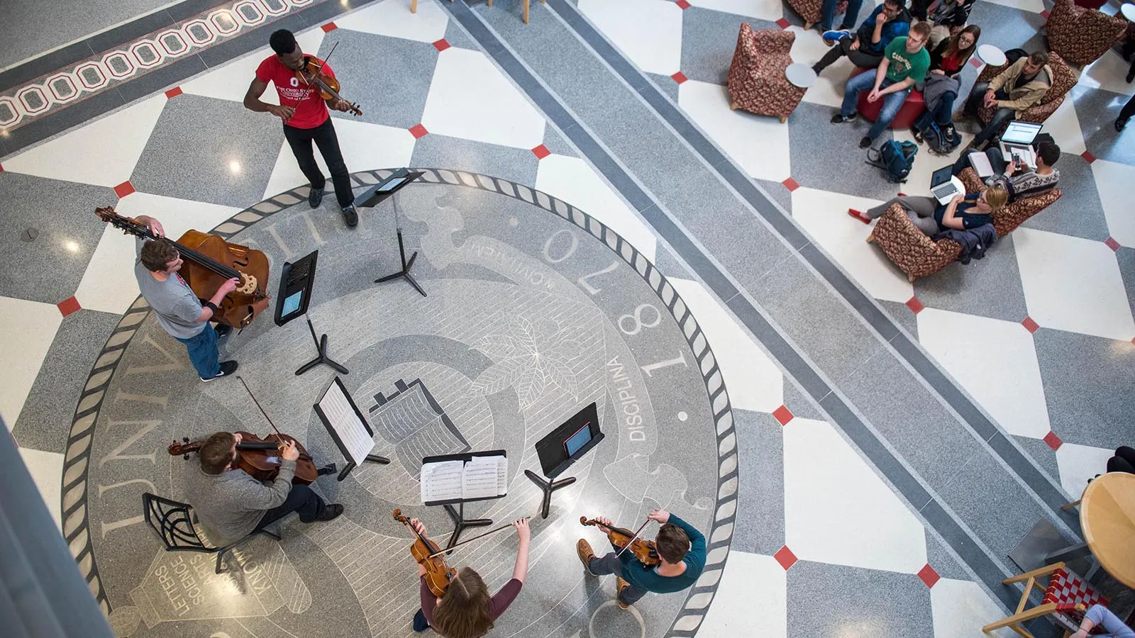 picture of a musical performance in front of a small audience.