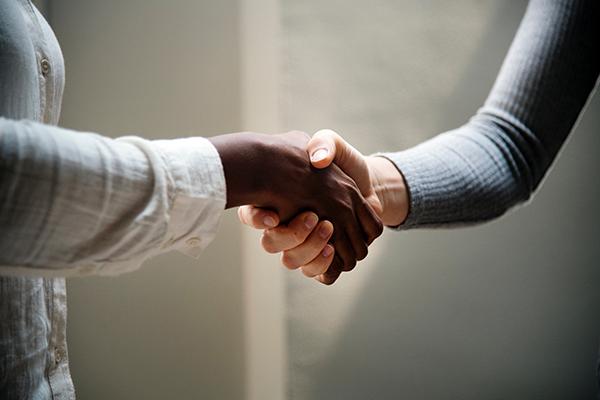 Two people shaking hands