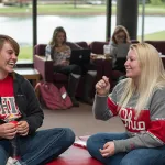 Two students conversing